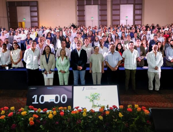 a group of people standing in front of a large crowd